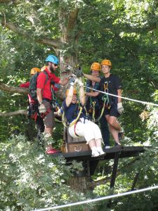 Kay Stephens on the zipline on a pre-conference tour during the NFPW Conference in South Carolina.