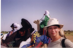 Ann Heinrichs at the Tuareg camel races in Agadez, Niger. The Tuareg are known as the “blue men of the desert” because the indigo dye in their turbans soaks into their skin.